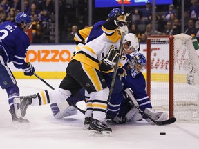 Pittsburgh Penguins forward Sidney Crosby (87) and Toronto Maple Leafs goaltender Frederik Andersen (31) go after a loose puck at Scotiabank Arena. Toronto defeated Pittsburgh. John E. Sokolowski-USA TODAY Sports