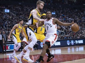 Raptors guard Kyle Lowry (7) controls a ball as Indiana Pacers forward Domantas Sabonis (11) defends during the second quarter at Scotiabank Arena. Nick Turchiaro-USA TODAY Sports