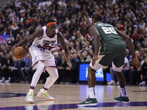 Toronto Raptors forward Pascal Siakam (43) tries to go around Milwaukee Bucks forward Marvin Williams (20) during the first half at Scotiabank Arena. : John E. Sokolowski-USA TODAY Sports