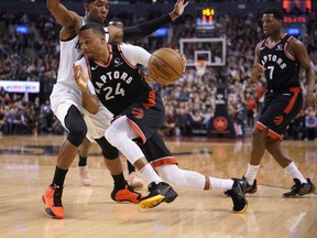 Raptors guard Norman Powell drives to the net against Charlotte Hornets guard Devonte’ Graham on Friday. Powell was seen moving gingerly after the game. John E. Sokolowski-USA TODAY Sports