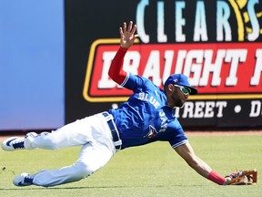 Blue Jays left fielder Lourdes Gurriel Jr. makes a diving/sliding catch of Neil Walker’s fourth-inning drive during yesterday’s game against the Phillies at TD Ballpark. Gurriel has already been pencilled in as the starter in left, while slotting in third in the Jays batting order.                         John David Mercer/
 USA TODAY Sports)
