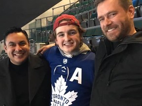 Hayden Pixner, 15, pose with Alex Mancilla (left) and Randy Shea (right) who gave the teen an Auston Matthews jersey after he was snubbed from getting a free jersey from a Leafs ambassador. The man sitting behind Hayden apparently caught the shirt and refused to give it to him. GREG PIXNER/FACEBOOK