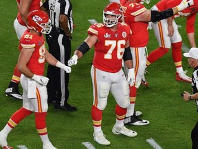 Guard for the Kansas City Chiefs Laurent Duvernay-Tardif (C-R) reacts during Super Bowl LIV between the Kansas City Chiefs and the San Francisco 49ers at Hard Rock Stadium in Miami Gardens, Florida, on February 2, 2020.