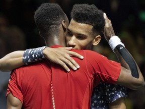 Gael Monfils from France, left, comforts Felix Auger-Aliassime from Canada after winning during the final of the ABN AMRO World Tennis Tournament in Rotterdam, Netherlands, on Feb. 16, 2020. (KOEN SUYK/ANP/AFP via Getty Images)