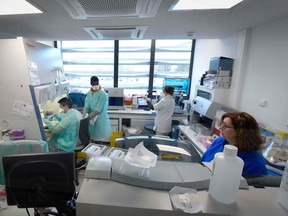 Medical staff from the IHU (Institut Hospitalo-Universitaire) Mediterranee Infection Institute are at work in the laboratory to analyse samples on the possible presence of the COVID-19 on 26 February 26, 2020 in Marseille.
