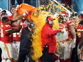 Kansas City Chiefs coach Andy Reid is dunked with Gatorade by his players Jordan Lucas (24) and Cameron Erving (75) in the fourth quarter of Super Bowl LIV at Hard Rock Stadium. (Geoff Burke-USA TODAY Sports)