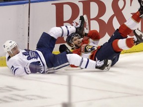 Toronto Maple Leafs defenceman Tyson Barrie takes down Florida Panthers winger Mike Hoffman on Thursday. AP PHOTO