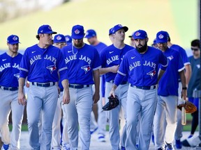 Toronto Blue Jays starting pitcher Matt Shoemaker leads the pitchers to warm ups during spring training at Spectrum Field.