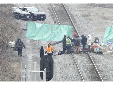 Protestors block the CN rail lines heading out of Hamilton towards the aldershot GO station in Oakville on Tuesday February 25, 2020. Jack Boland/Toronto Sun/Postmedia Network