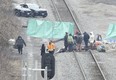 Protestors block the CN rail line between Hamilton and Aldershot GO station in Burlington on Tuesday.