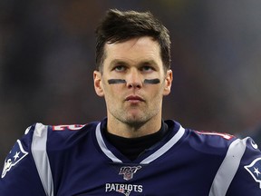Tom Brady of the New England Patriots reacts from the sidelines as they take on the Tennessee Titans in the second quarter of the AFC Wild Card Playoff game at Gillette Stadium on Jan. 4, 2020 in Foxborough, Mass.