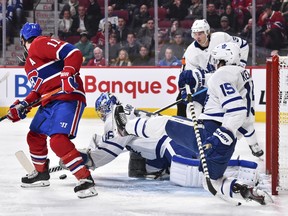 Maple Leafs goaltender Jack Campbell dives for the puck near Brendan Gallagher (11) of the Montreal Canadiens during the second period at the Bell Centre on Saturday night.  (Minas Panagiotakis/Getty Images)