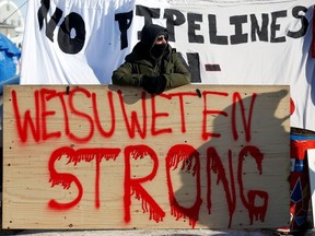 Supporter of the indigenous Wet'suwet'en Nation's hereditary chiefs camps at a railway blockade as part of protests against British Columbia's Coastal GasLink pipeline, in Edmonton, Alberta, Canada February 19, 2020.