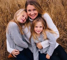 Sarah Cotton holds her daughters Chloe, left, and Aubrey Berry in October 2017 in this handout photo. Two months later the girls were murdered by their father. HANDOUT