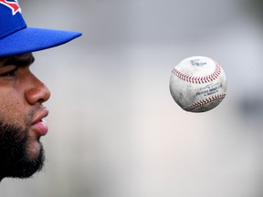 Blue Jays pitcher Yennsy Diaz juggles a baseball during spring training workouts on Thursday in Florida. (USA TODAY SPORTS)
