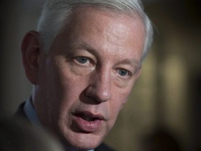 Dominic Barton, Canada's new ambassador to China, talks with reporters at the World Economic Forum in Davos, Switzerland on Wednesday, Jan. 24, 2018. (THE CANADIAN PRESS/Paul Chiasson)