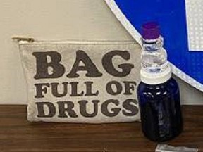 Two bags marked "Bag Full of Drugs" were found among the belongings of two Florida men arrested Saturday for drug trafficking. It was as advertised, police say. (Florida Highway Patrol)