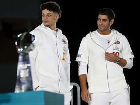 Quarterback Patrick Mahomes (left) of the Kansas City Chiefs and quarterback Jimmy Garoppolo of the San Francisco 49ers take part in Super Bowl Opening Night at Marlins Park on January 27, 2020 in Miami. (Michael Reaves/Getty Images)