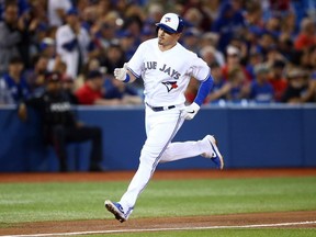 Reese McGuire of the Toronto Blue Jays rounds third base after hitting a home run in the fourth inning during a MLB game against the Boston Red Sox at Rogers Centre on September 10, 2019 in Toronto, Canada.