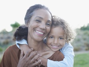 Boy hugging grandmother