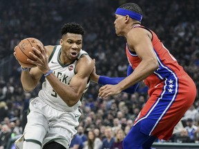 Giannis Antetokounmpo (left) and the Milwaukee Bucks take on the Raptors tonight. USA TODAY