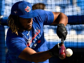 Blue Jays third baseman Vladimir Guerrero Jr. practises during spring training at Spectrum Field in Dunedin, Fla., yesterday. Manager Charlie Montoyo says the hype over Guerrero has led to some unrealistic expectations. USA TODAY