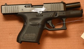 One of two handguns allegedly seized when three suspects were arrested for a series of robberies in Milton and Georgetown in December 2019 and January 2020. (Halton Regional Police handout)
