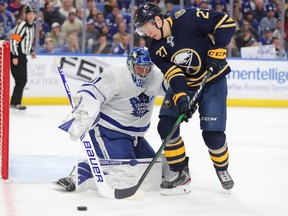 Toronto Maple Leafs goaltender Frederik Andersen looks to make a save on Buffalo Sabres center Curtis Lazar during the second period at KeyBank Center.