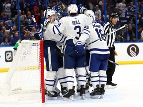Justin Holl and his Leafs teammates celebrate their win over Florida. USA TODAY