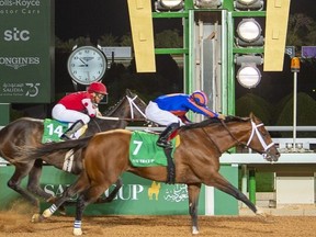 Jockey Luis Saez (right) rides his horse Maximum Security as he competes in the $20 million US race, the final race of the Saudi Cup -- the world's richest horserace -- at the King Abdulaziz Racetrack in Jenadriyah near the Riyadh, Saudi Arabia. (Getty images)