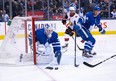 Maple Leafs goaltender Michael Hutchinson tries to control a loose puck in front of his net during the second period against the Ottawa Senators on Saturday night at the Scotiabank Arena. (Nick Turchiaro/USA TODAY Sports)