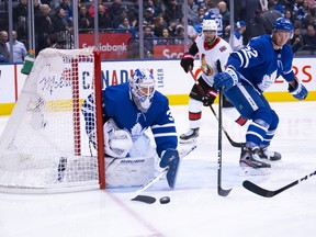 Maple Leafs goaltender Michael Hutchinson tries to control a loose puck in front of his net during the second period against the Ottawa Senators on Saturday night at the Scotiabank Arena. (Nick Turchiaro/USA TODAY Sports)
