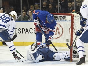 Rangers centre Filip Chytil (72) slides into the net as Toronto Maple Leafs goaltender Michael Hutchinson makes a save during the second period at Madison Square Garden on Wednesday night. (Sarah Stier/USA TODAY Sports)