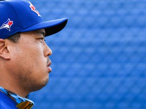 Blue Jays starting pitcher Hyun-Jin Ryu looks on during spring training workouts at Spectrum Field on Thursday. (USA TODAY SPORTS)