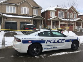 Peel Regional Police on Monday, Feb. 10, 2020 at the scene of a fatal stabbing the day before in the basement apartment of a home on Roadside Way in Mississauga. (Kevin Connor/Toronto Sun)
