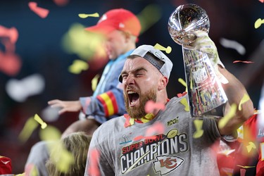 Travis Kelce of the Kansas City Chiefs celebrates with the Vince Lombardi Trophy after defeating the San Francisco 49ers in Super Bowl LIV at Hard Rock Stadium on February 2, 2020 in Miami. (Maddie Meyer/Getty Images)