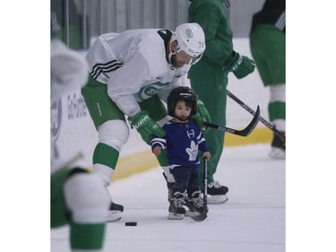Toronto Maple Leafs Kyle Clifford gives some tips to one of his three sons - Cooper - at the end of Leafs practice in Toronto on Wednesday February 19, 2020. Jack Boland/Toronto Sun/Postmedia Network