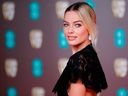 Margot Robbie poses on the red carpet upon arrival at the BAFTA British Academy Film Awards at the Royal Albert Hall in London on Feb. 2, 2020. (TOLGA AKMEN/AFP via Getty Images)