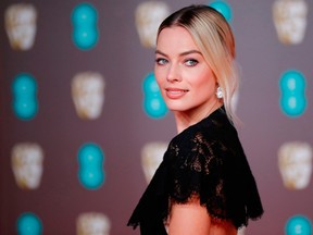 Margot Robbie poses on the red carpet upon arrival at the BAFTA British Academy Film Awards at the Royal Albert Hall in London on Feb. 2, 2020.  (TOLGA AKMEN/AFP via Getty Images)