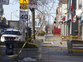 Toronto Police at the scene of the city's ninth homicide of the year after a man was gunned down outside a bar on Danforth Ave., just east of Greenwood Ave., on Wednesday, Feb.5, 2020. (Chris Doucette/Toronto Sun)