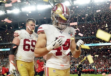 Francisco 49ers' Kyle Juszczyk and Mike McGlinchey look dejected after the game. (REUTERS/Mike Blake)