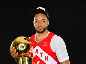 Norman Powell of the Toronto Raptors poses for a portrait with the Larry O'Brien Trophy after winning Game Six of the 2019 NBA Finals against the Golden State Warriors on June 13, 2019.  (Photo by Jesse D. Garrabrant/NBAE via Getty Images)