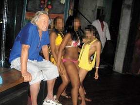 Shocking photos have surfaced which show fashion mogul Peter Nygard with bikini-clad young women. (Splashnews)