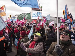 Members of the Ontario Federation of Labour protest outside the Scotiabank Convention Centre during the Ontario Progressive Conservative party 2020 policy convention in Niagara Falls, Ont. on Saturday, Feb. 22, 2020. (THE CANADIAN PRESS/ Tijana Martin)