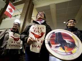 Members of Beaver Hills Warriors and Extinction Rebellion Edmonton protest further expansion of the oil sands, specifically the Teck Frontier Mine, inside Canada Place, in Edmonton Wednesday Jan. 22, 2020. (David Bloom/Postmedia Network)