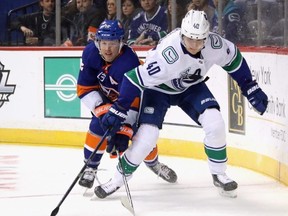 Elias Pettersson, right, and the Vancouver Canucks take on the Maple Leafs Saturday night at Scotiabank Arena. (Getty Images)
