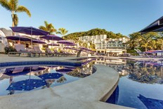 Relax poolside at the Planet Hollywood Beach Resort.