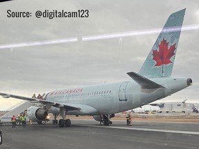 An Air Canada Airbus A319 sits on the runway at Pearson International Airport after making an emergency landing Tuesday afternoon. (Cameron Milne photo)