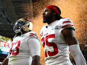 San Francisco 49ers cornerback Richard Sherman (right) walks off the field after losing to the Kansas City Chiefs in Super Bowl LIV at Hard Rock Stadium in Miami Gardens, Fla., on Feb. 2, 2020.