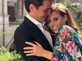 In this undated handout photo released by Buckingham Palace and taken recently in Italy by Princess Beatrice's sister Princess Eugenie, Princess Beatrice and Edoardo Mapelli Mozzi pose together as their engagement is announced in September 2019.